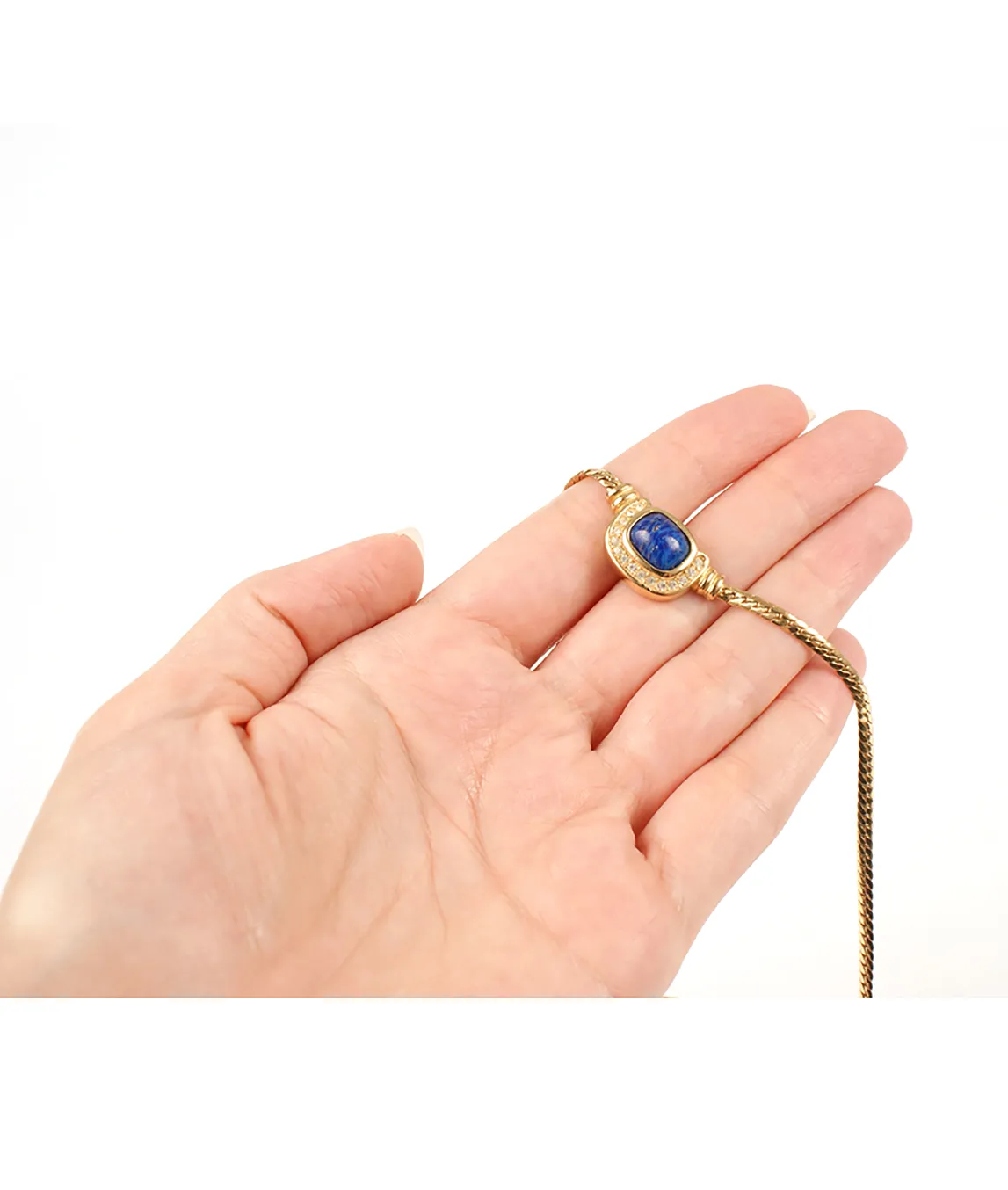 Dior necklace in hand