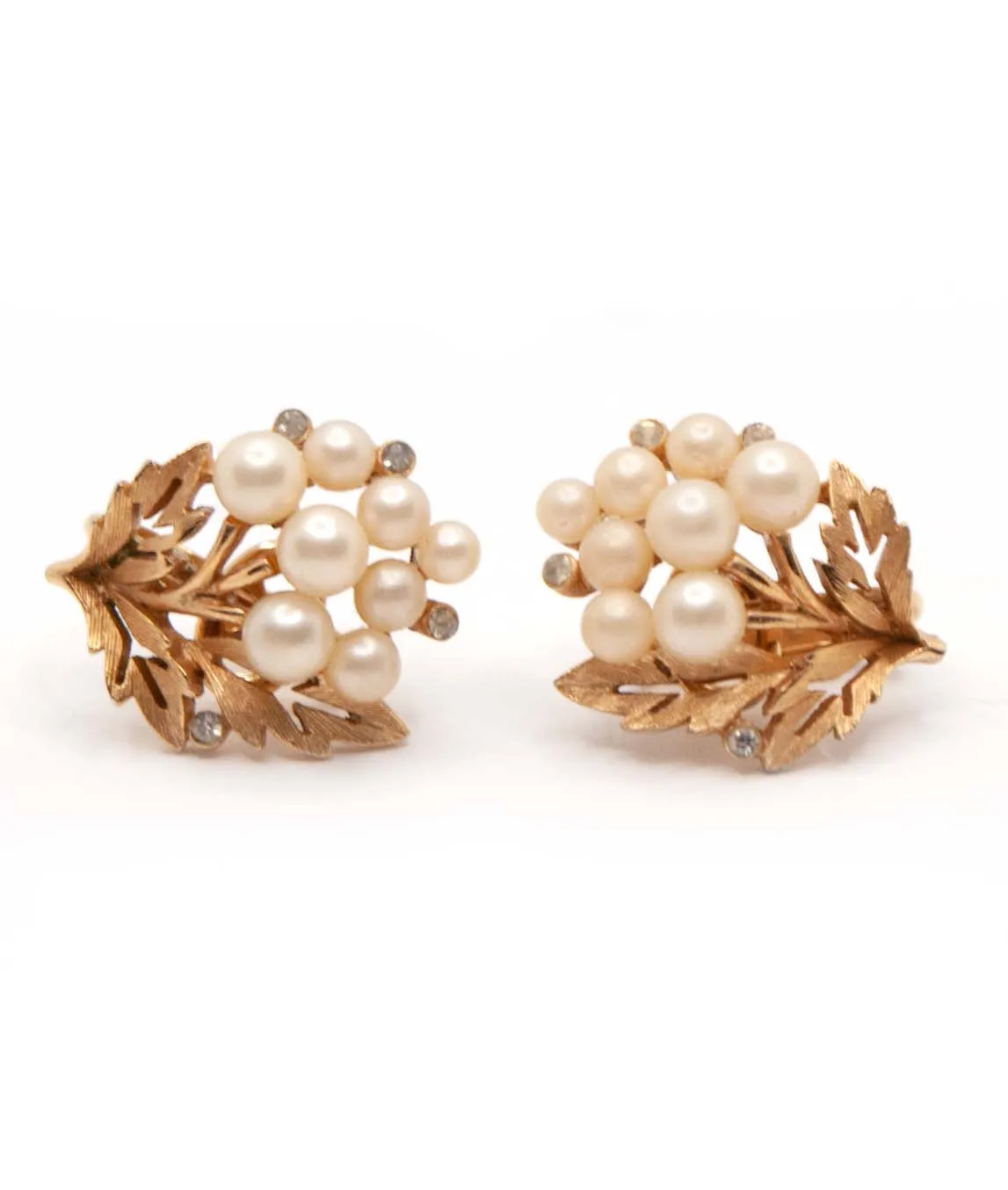 Crown Trifari textured gold plated earrings with faux pearls and rhinestones side view