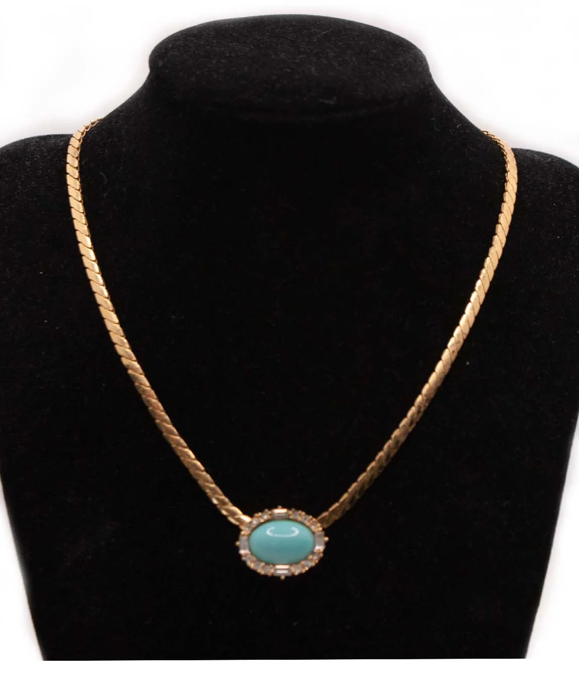 Christian Dior necklace with turquoise cabochon on black display